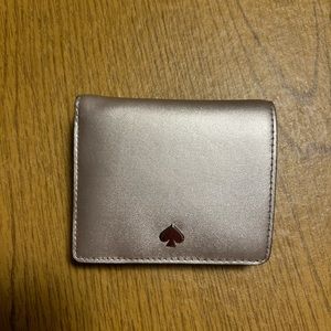 Kate Spade Champagne colored wallet.